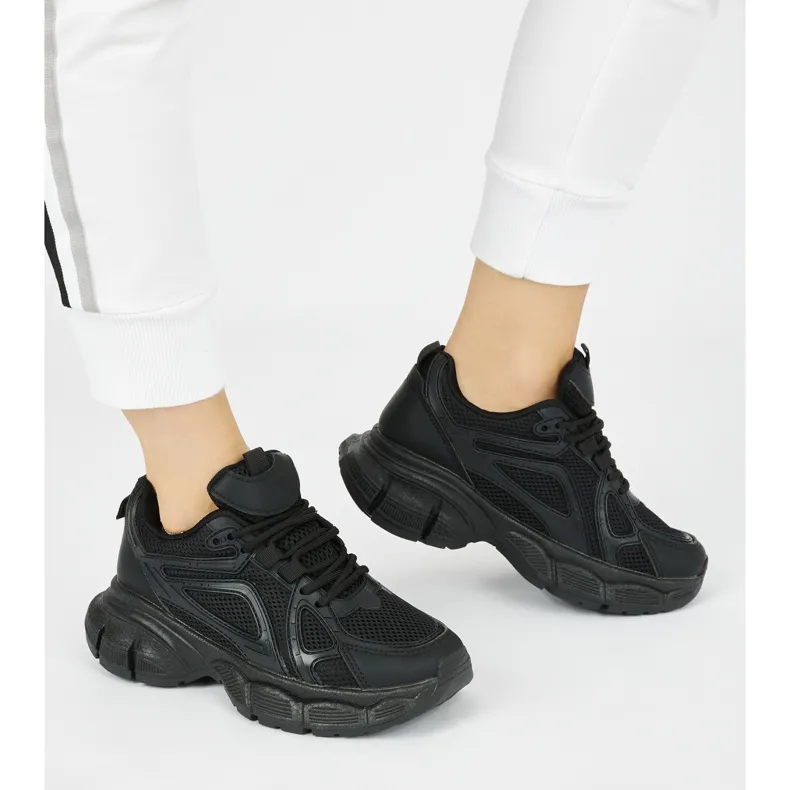 Black sneakers with a thick sole