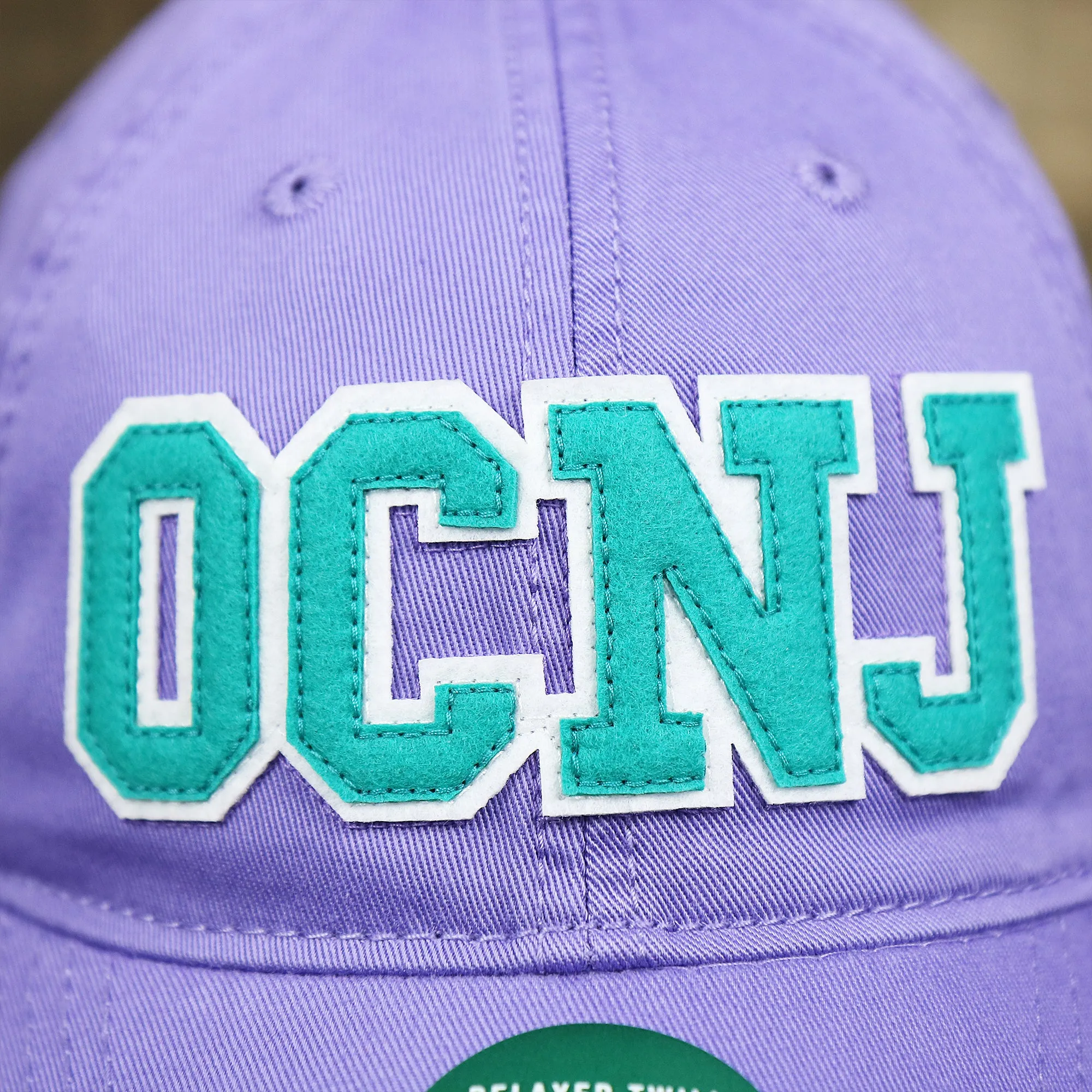 Teal OCNJ Wordmark White Outline Dad Hat | Lavender Dad Hat